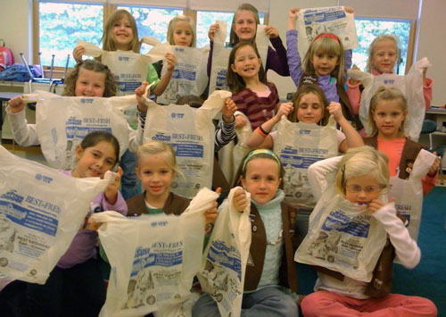 scouting-for-food Brownie Troop #2770 preparing bags for the 2009 Scouting for Food Drive (contributed photo)
