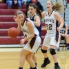 Kendyl Finelli (#11,  ball), Abby Joseph (#4, behind), Emily Carens (#22, r)