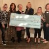 100 Women of Southborough's founding board members presenting a ceremonial check to the Taly Foundation L-R: Karyn Clarke, Kate Diodati, Jennifer Triompo, Terri Grogan, Jill Dixon (Taly Foundation President & Co-Founder), Jamie Mieth, Stephanie Wysocki, and Lisa Fruhan. (Missing founding member Emily Woodworth.)