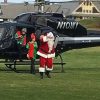 Santa emerging from helicopter in 2017 (by Beth Melo)