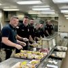 Officers serving lunch - photo contributed by Finn School