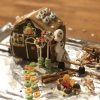 Gingerbread houses from workshops in prior years (photos edited from Facebook posts)