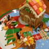 Gingerbread houses from workshops in prior years (photos edited from Facebook posts)