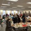 Shopping at the Friends of Library Holiday Book Sale (photo from Library Facebook post)