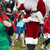 Santa makes his way through the crowd (photo by Beth Melo)