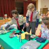 Scouts help shoppers find items at Troop 1's Kids Shop (photo by Beth Melo)