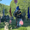 Colonel Jackman reads the names of veterans laid to rest in Southborough over the past year