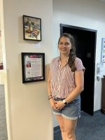 Amanda Oakleaf with her art (from Library Facebook post)