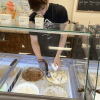Connor Lester scooping ice cream (photo by Beth Melo)