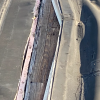 Close up of exposed, damaged deck (image of screenshot from January 30, 2026 School Committee Meeting)