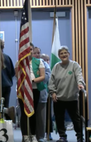 Carol Saunders at Town Meeting with her Girl Scout troop (cropped from meeting video)