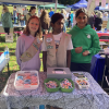 Girl Scouts fundraise at a booth on Heritage Day Field - 2026 (photo by Beth Melo).png